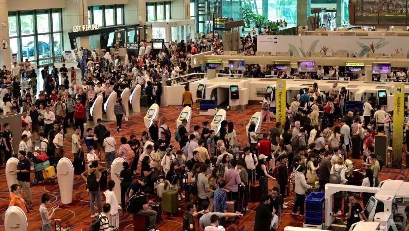 People were seen waiting with their families for flights to take off at Terminal 1 of Singapore's Changi Airport.