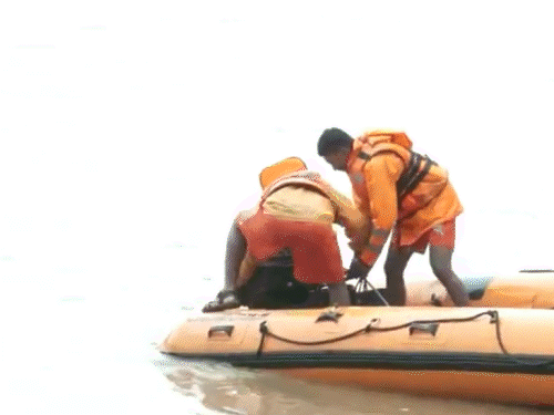 An NDRF team is conducting search and rescue operation to find missing persons due to landslide in Shirur village of Ankola.