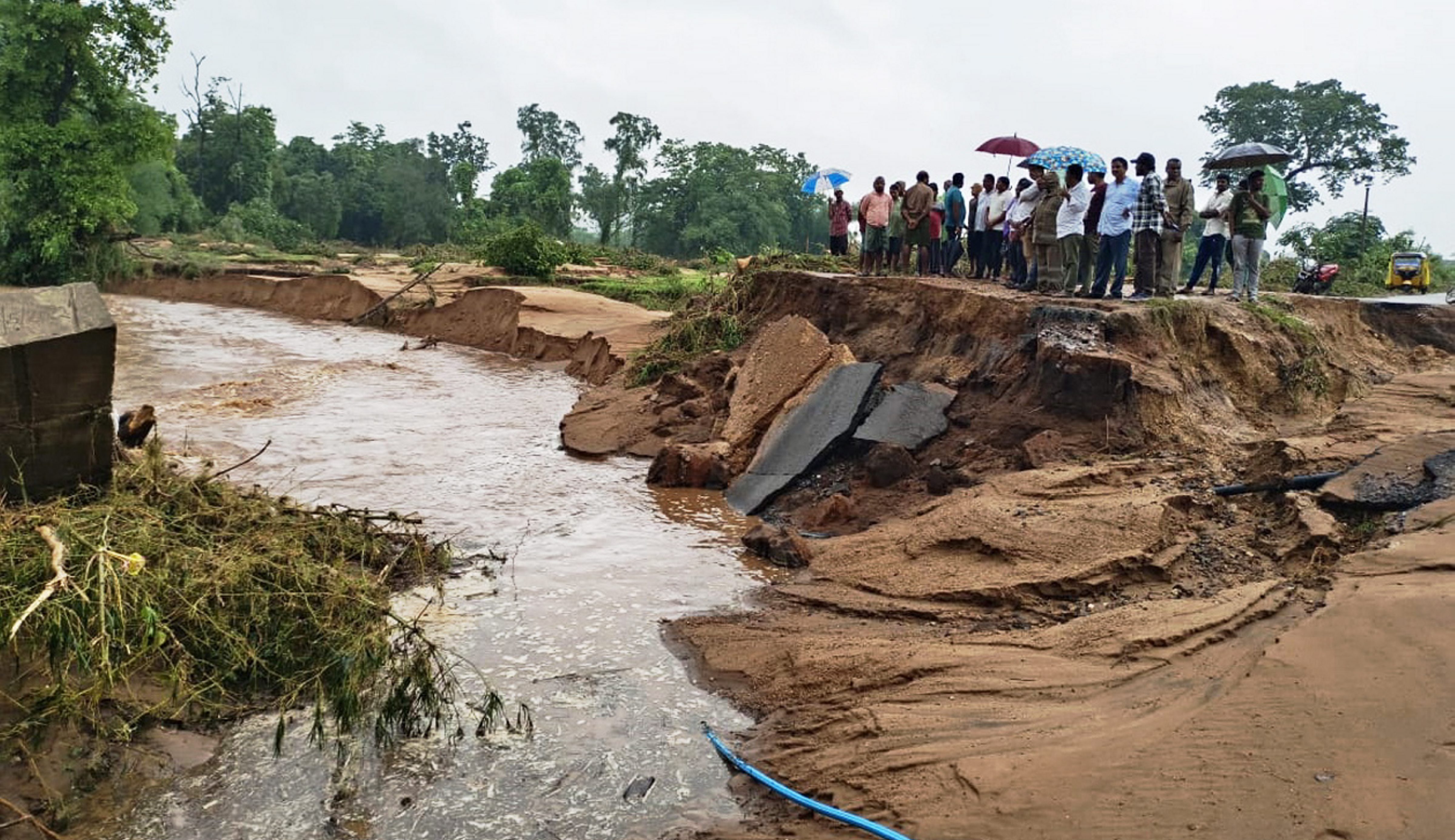 A portion of a road collapsed due to floods caused by heavy rains in Kothagude, Telangana.