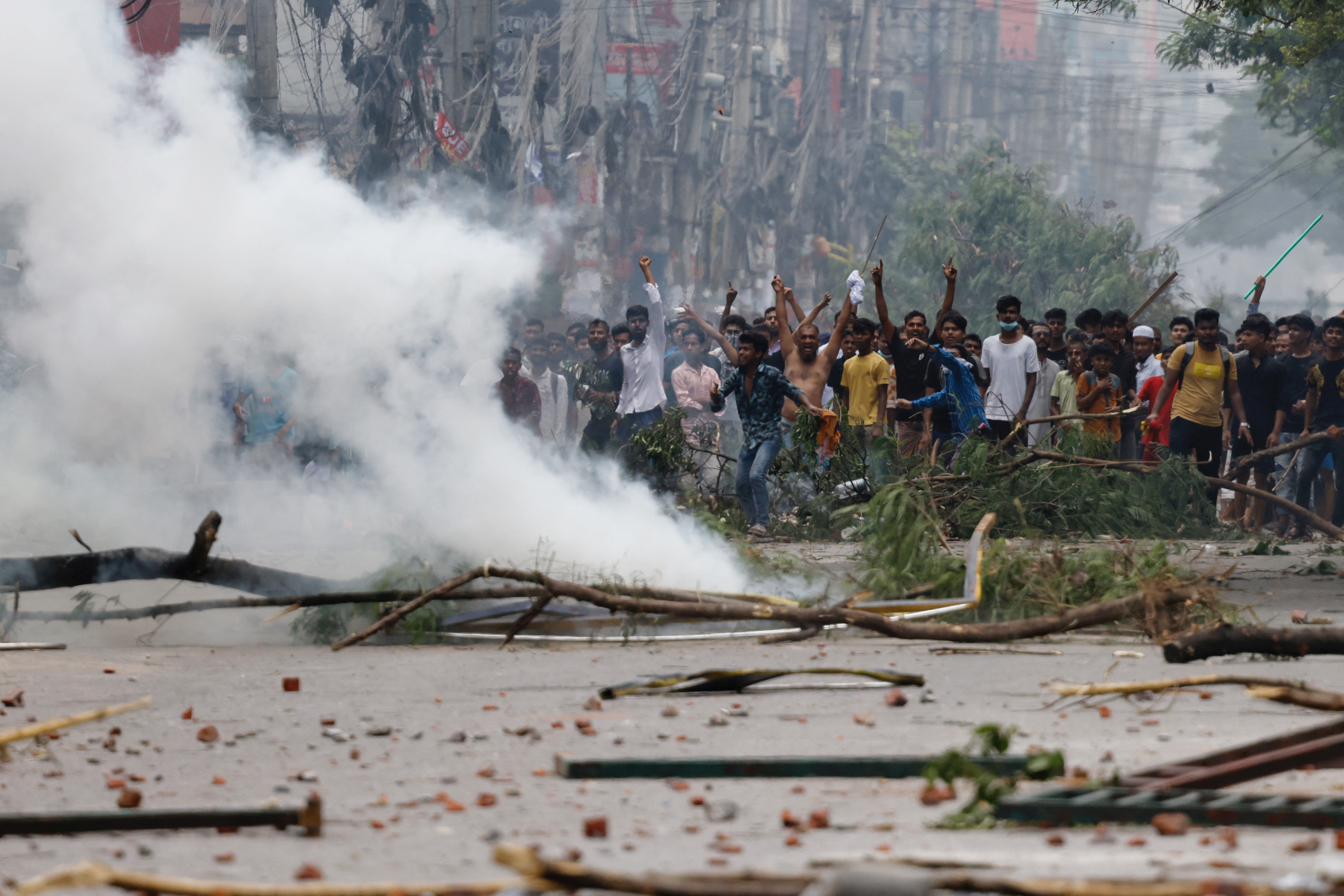 The picture is from Dhaka where people set fire to the road and blocked it by cutting trees to escape from the security forces.