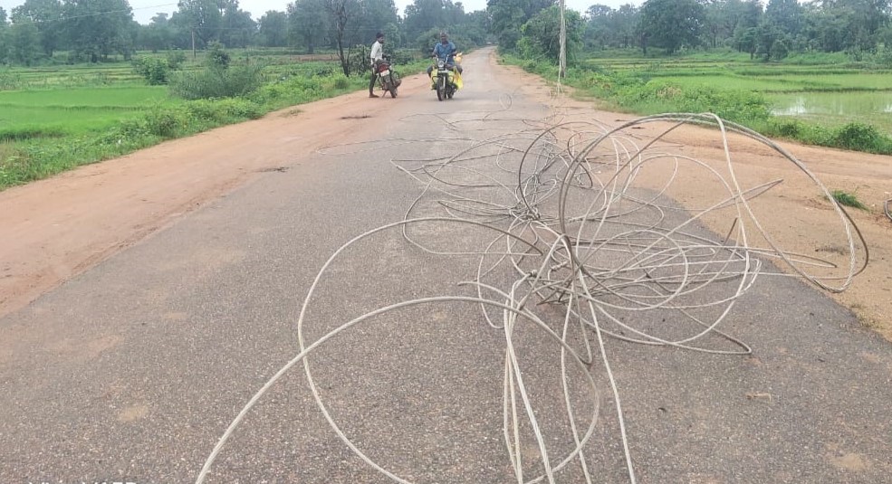 The wire along with the electric pole broke and fell on the road, it ...