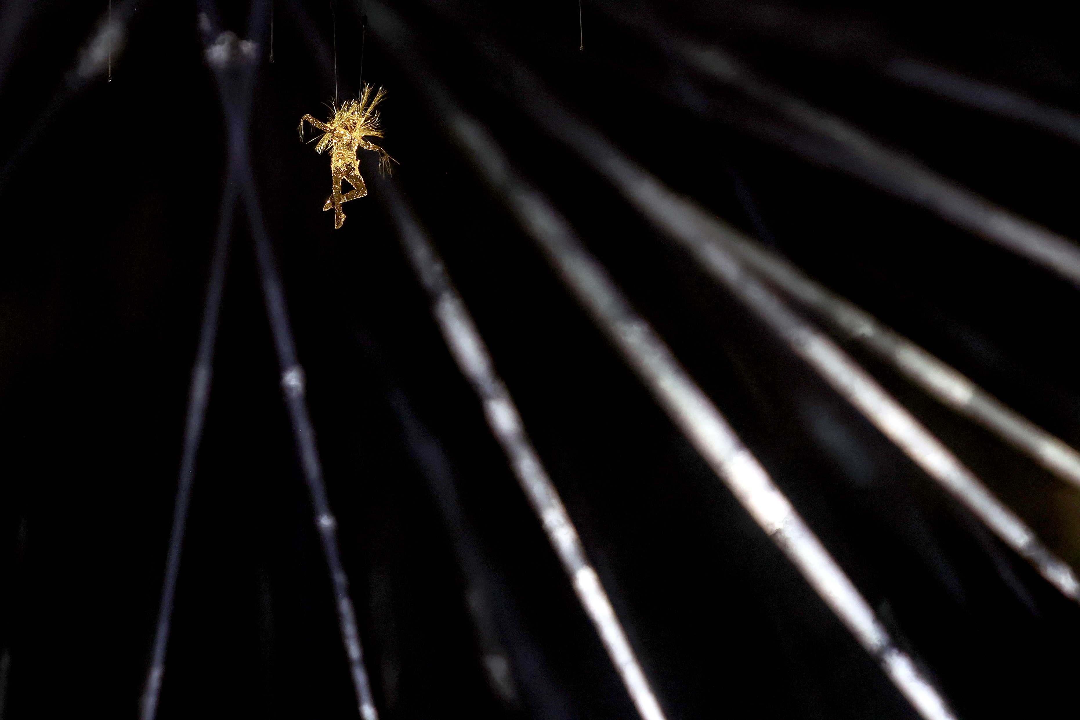 Golden Voyager descending from the sky.