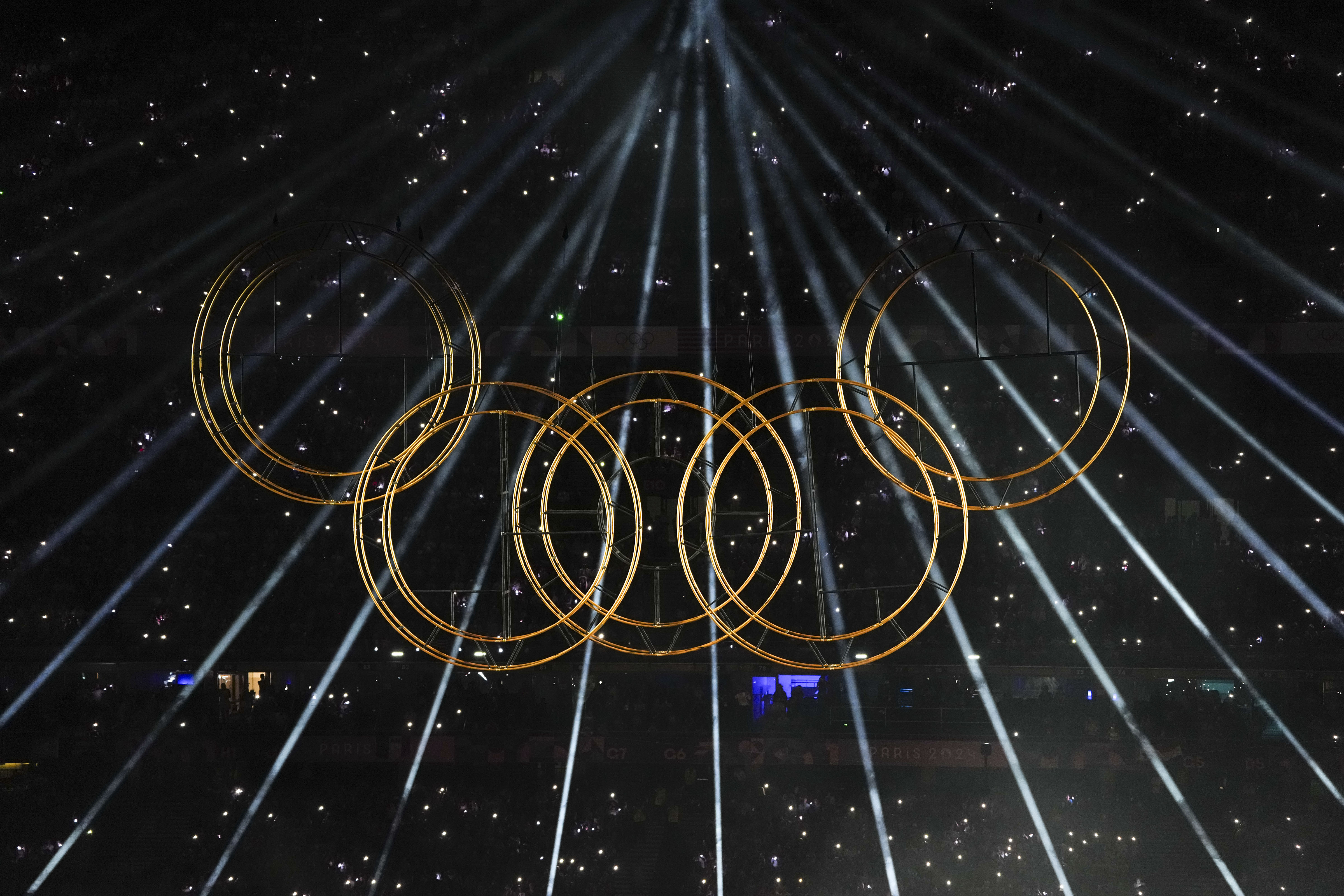 Olympic rings during laser lighting in the stadium.