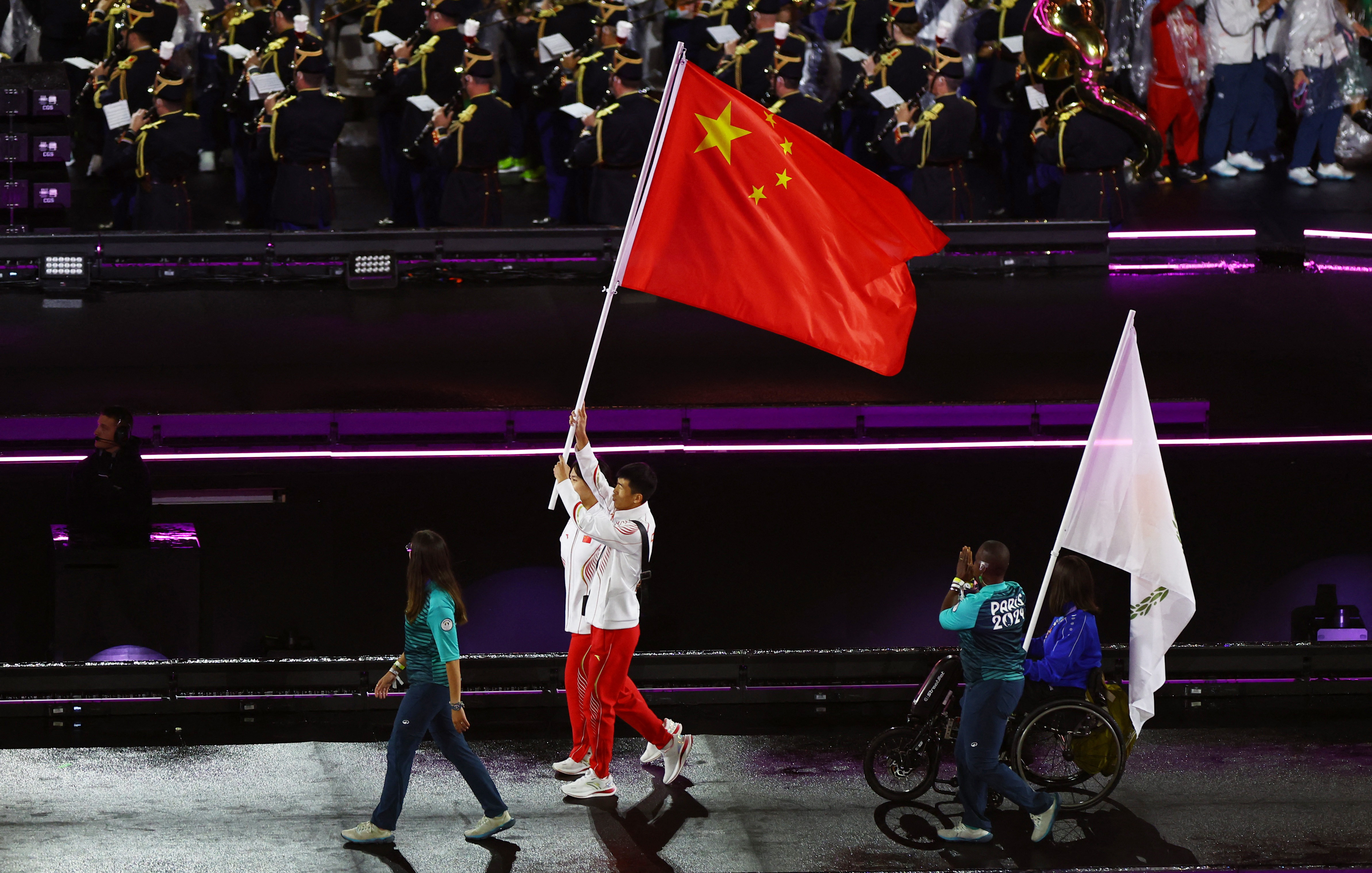 Flag bearers from China during the Parade of Nations ceremony. China has won the most medals at the Paralympics, with 220. These include 94 gold medals.