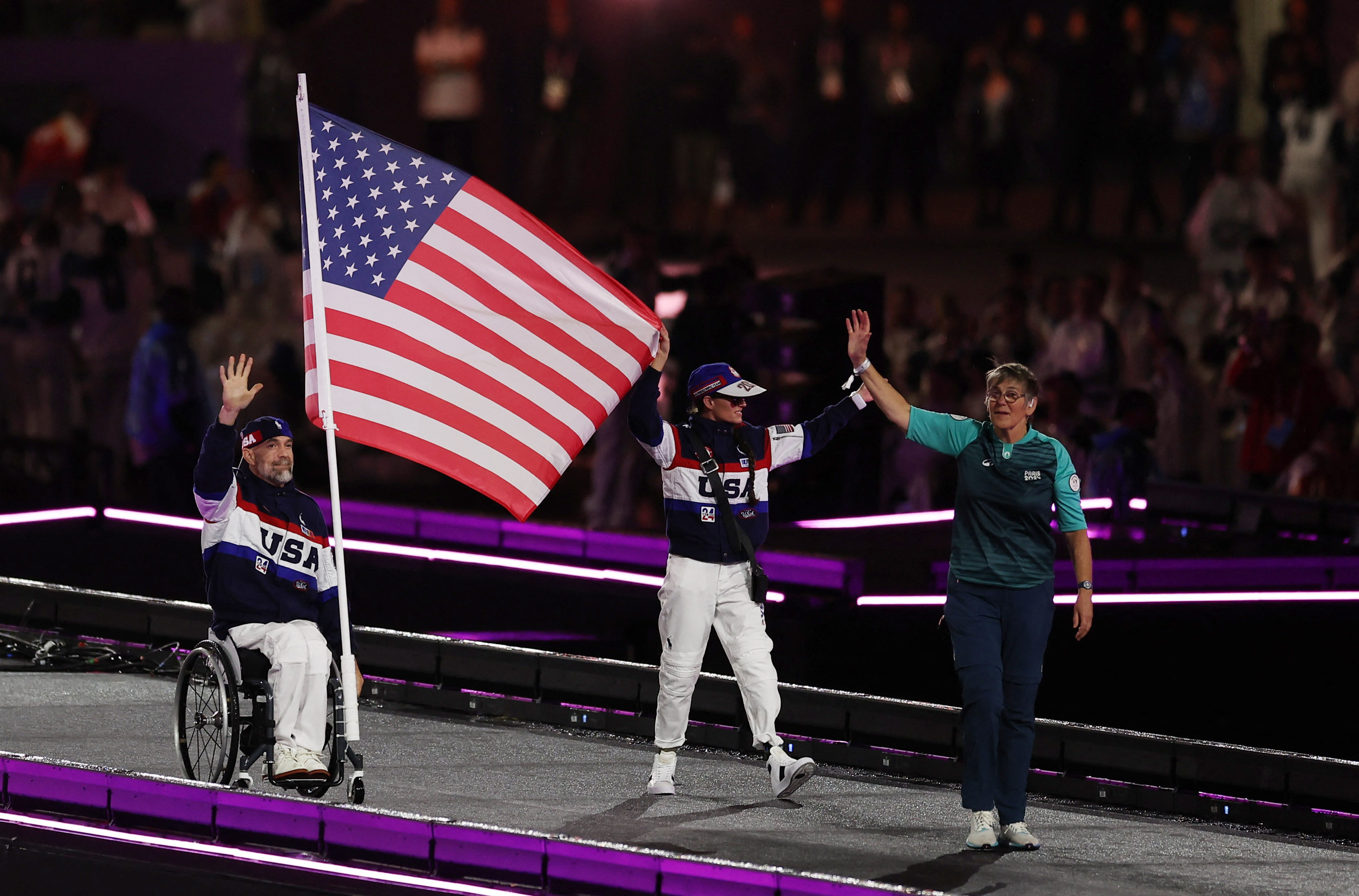 American athletes carry the US flag during the Parade of Nations. The 2028 Paralympic Games will be held in Los Angeles, USA.