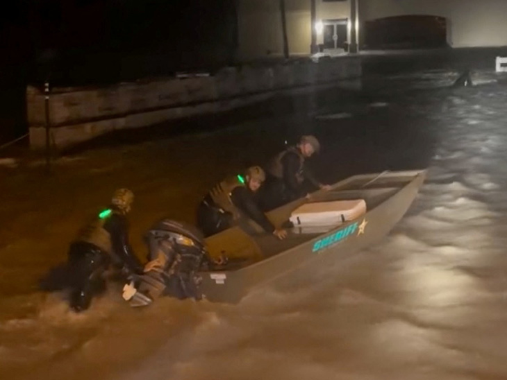 The picture is from Florida, where rescue workers are taking boats to rescue people in flood affected areas.