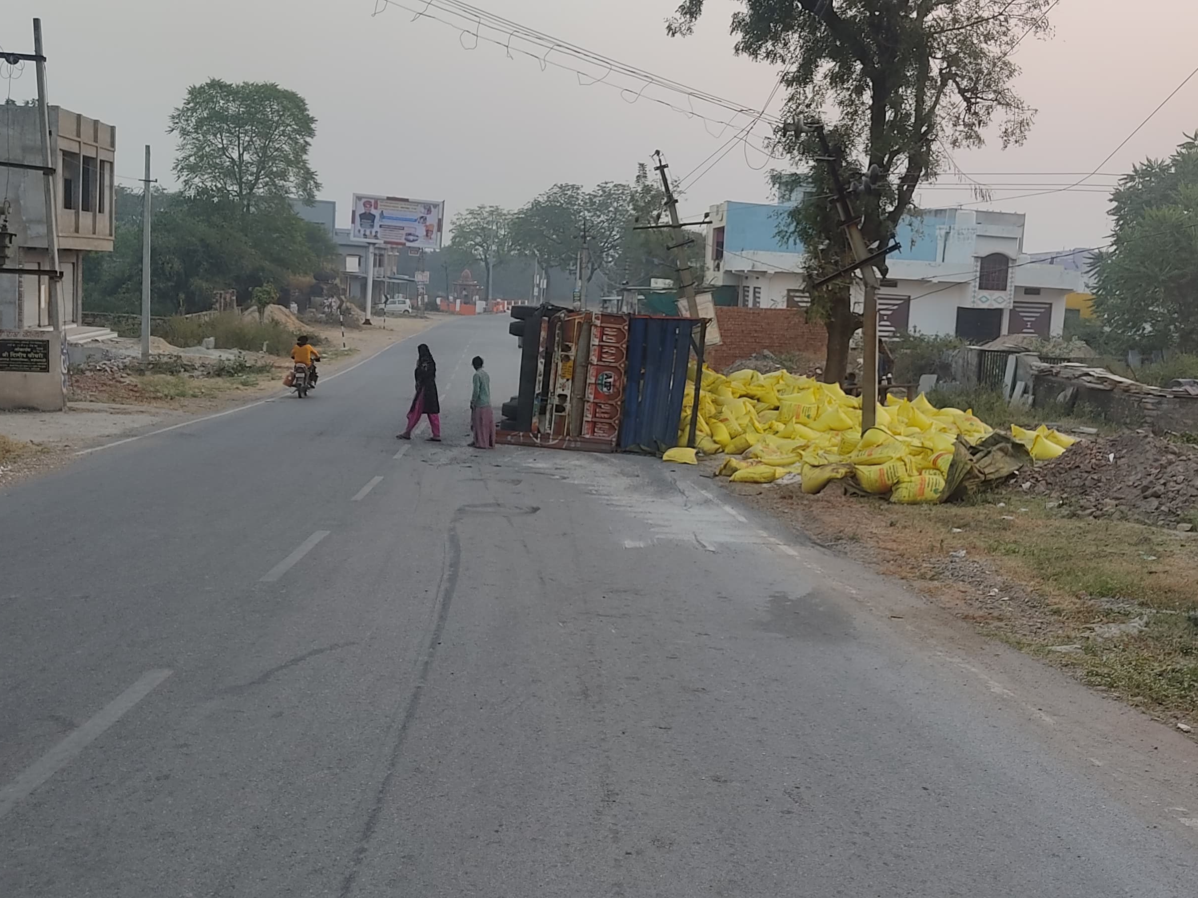 The uncontrolled truck collided with the electric pole and overturned