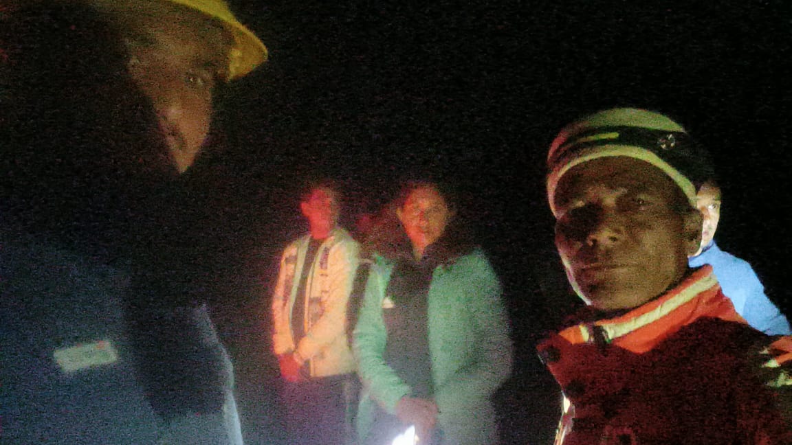 Members of the rescue team engaged in searching the young man who fell from the road of Malana.