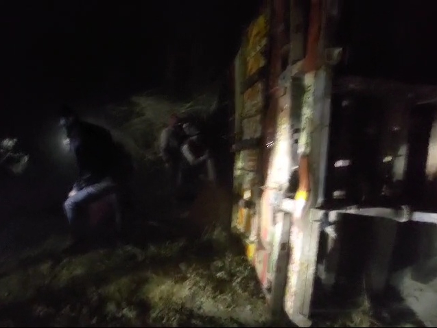 A truck loaded with LPG gas cylinders overturned