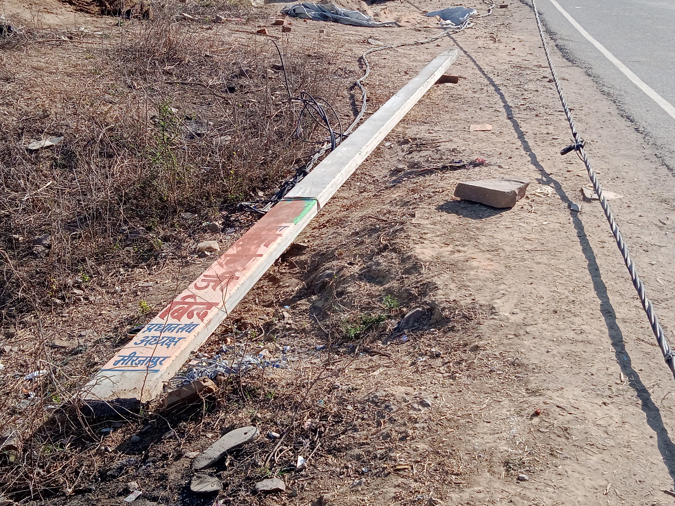 A truck loaded with sand hit an electric pole