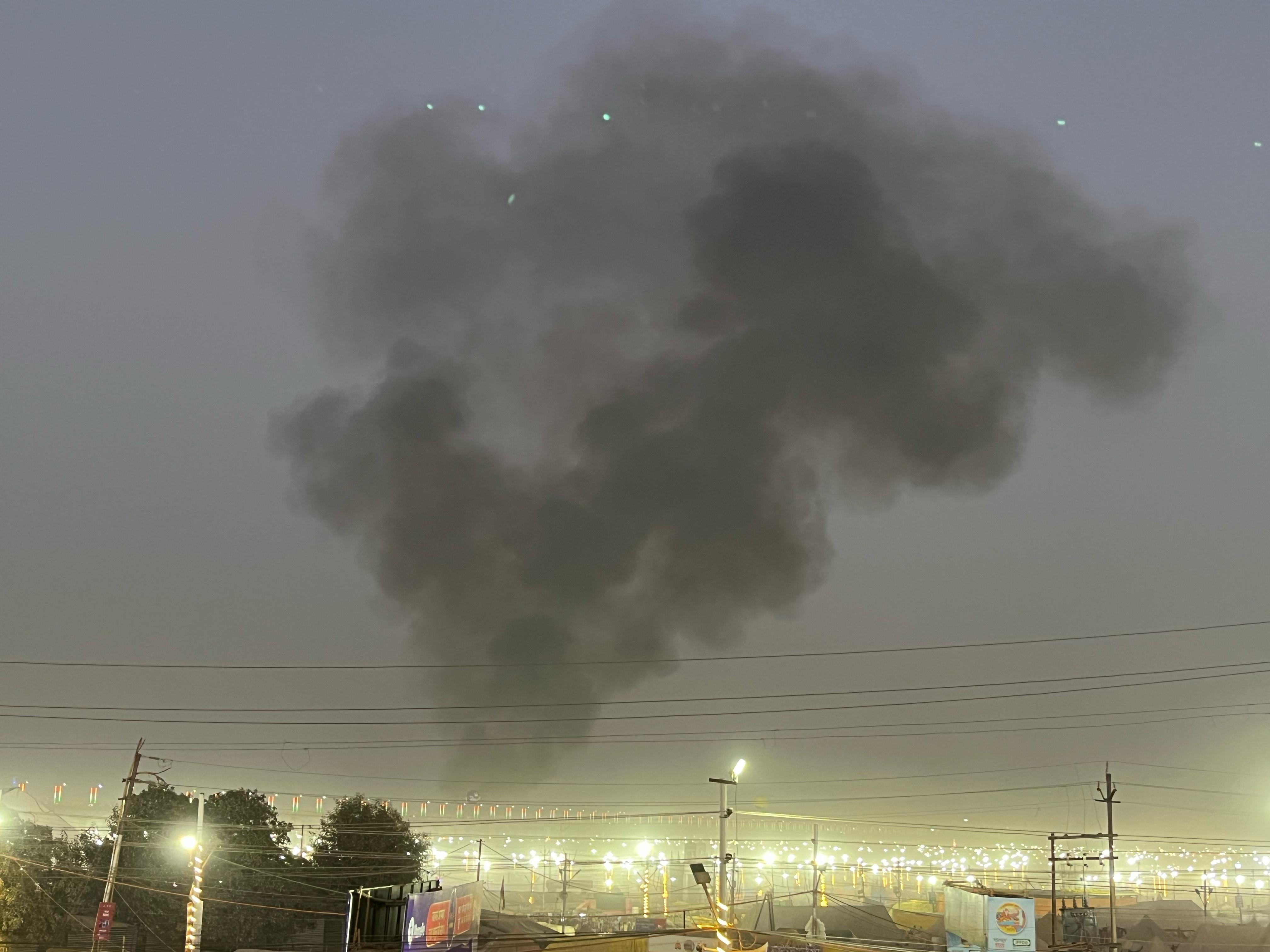 The smoke rising from the fire appeared far and far.