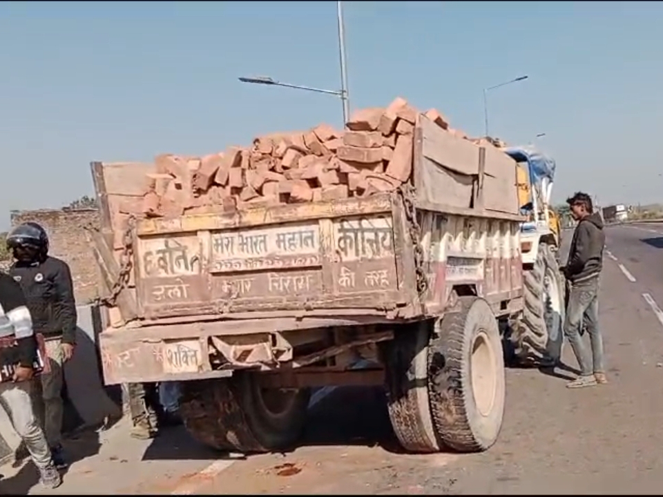 A truck collided with a tractor-trolley loaded with bricks