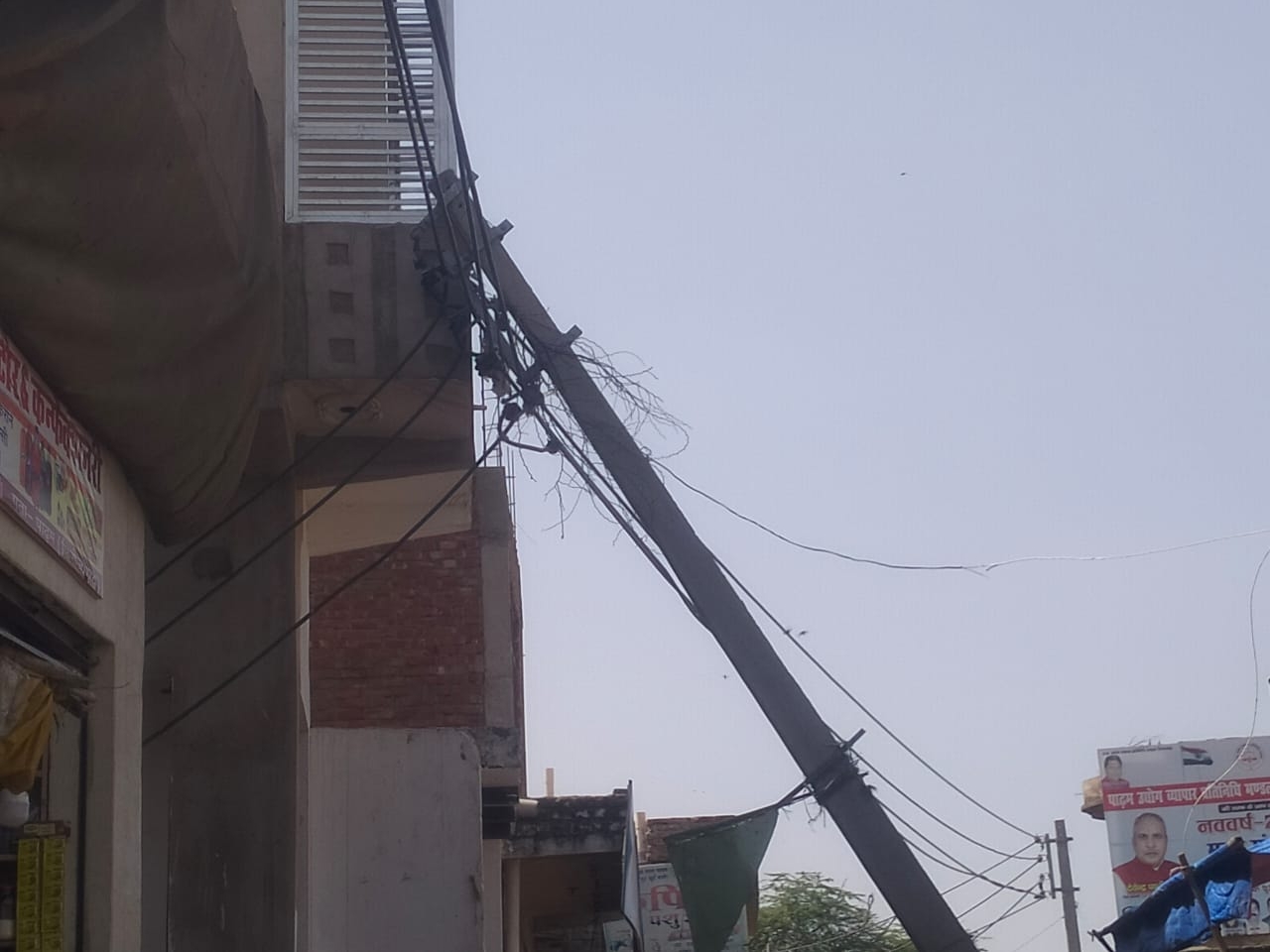 A dilapidated electric pole fell on a house in Jasrana