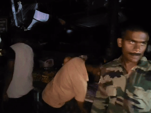 Army employee while closing the fruit hand cart.