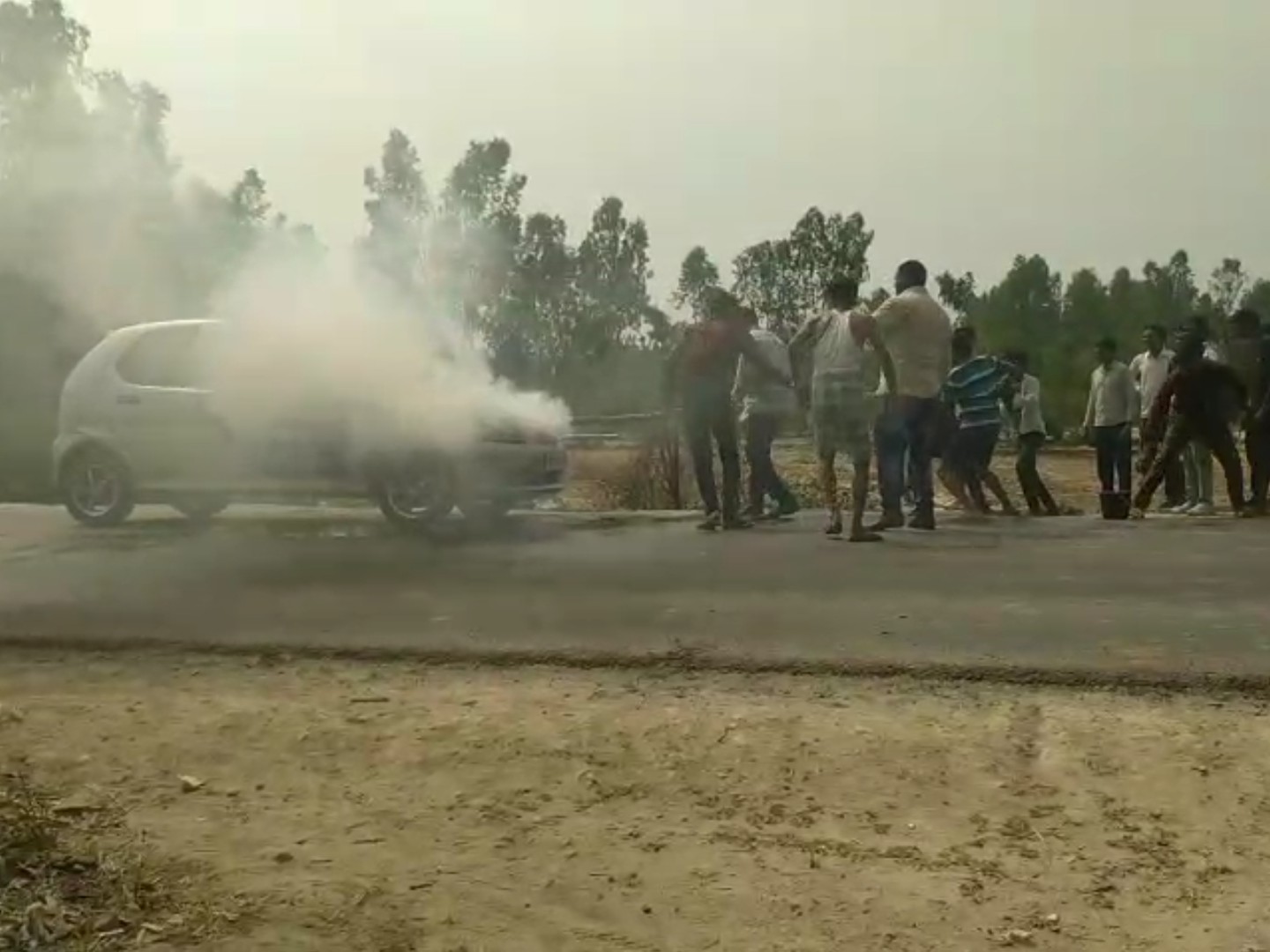 The car of a family returning from a wedding caught fire