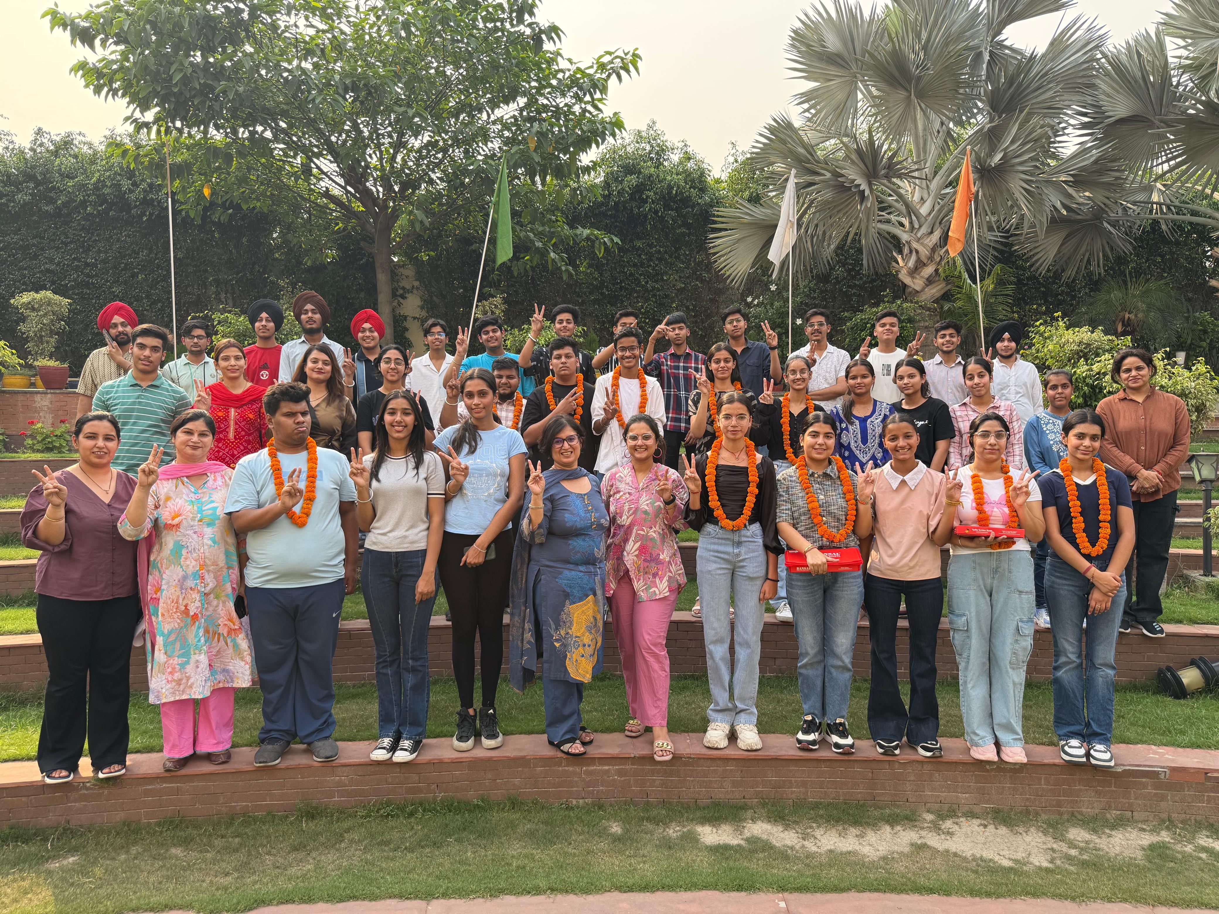 Manisha Dhanuka, Principal of Stallwots School, celebrating with students.