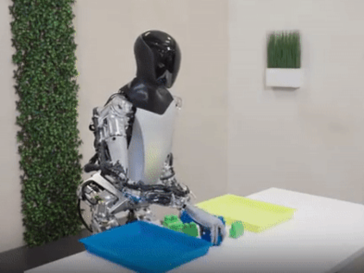 Tesla's robot selects the blocks of colors and separates itself.