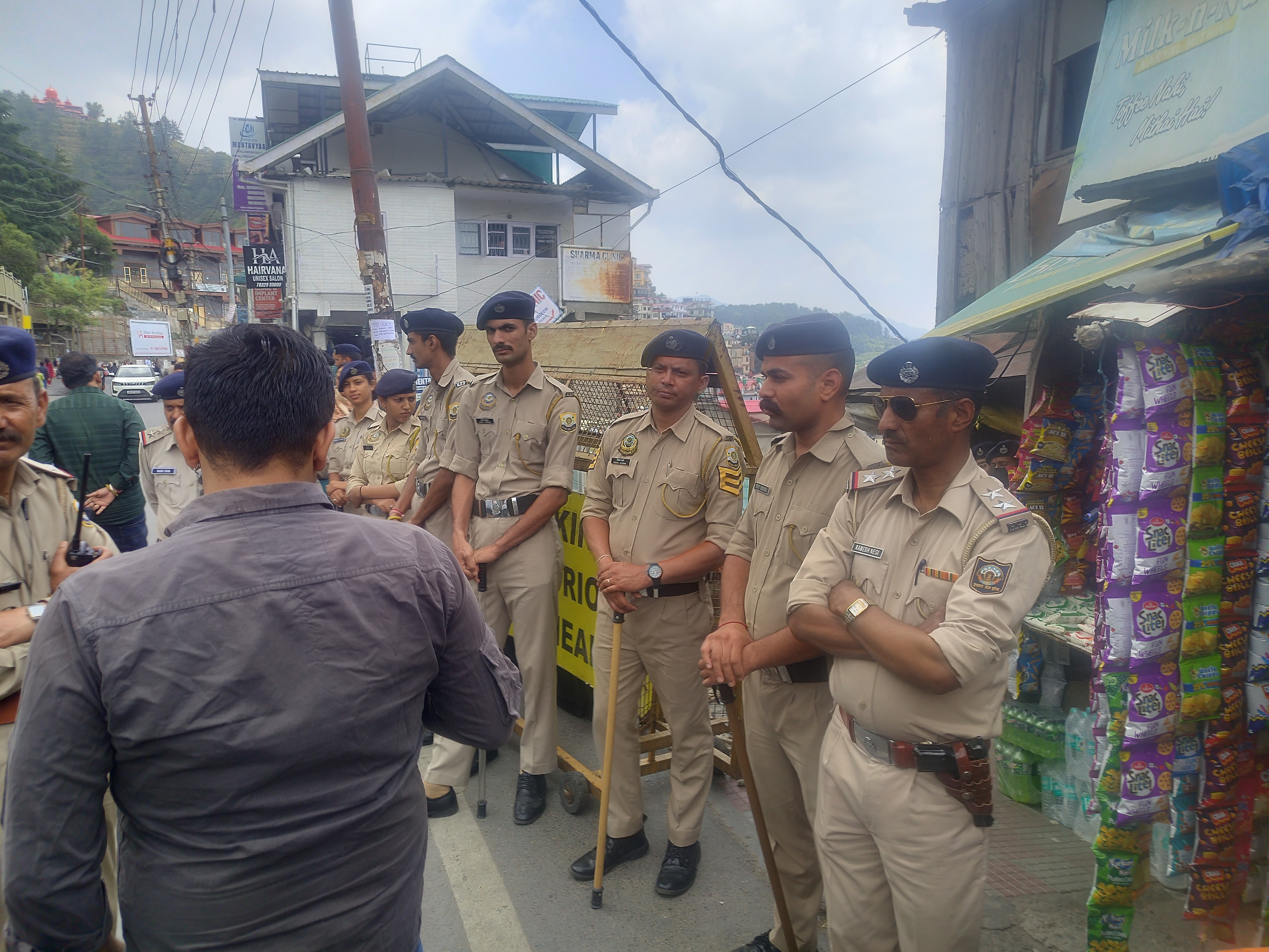 Police personnel posted near the mosque at some distance from Sanjauli Chowk