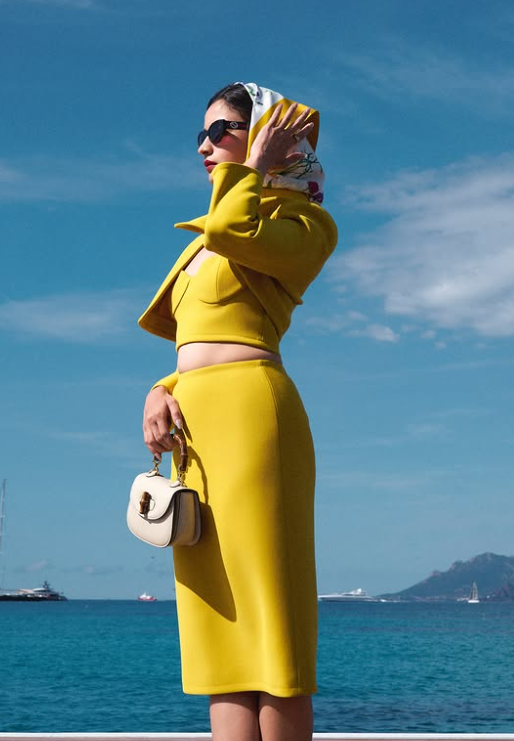 The actress completed the look with mini clutch and sun glasses.