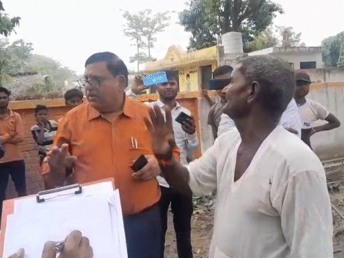 Villagers complaining to officers about the tank falling in Lakhimpur.
