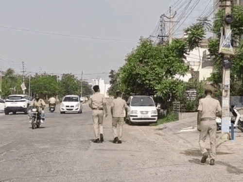 Police personnel outside the businessman's house in Jind.