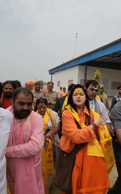 There were many garlands of Rudraksha around Mamta Kulkarni neck. He had a long bag hanging on his shoulder.