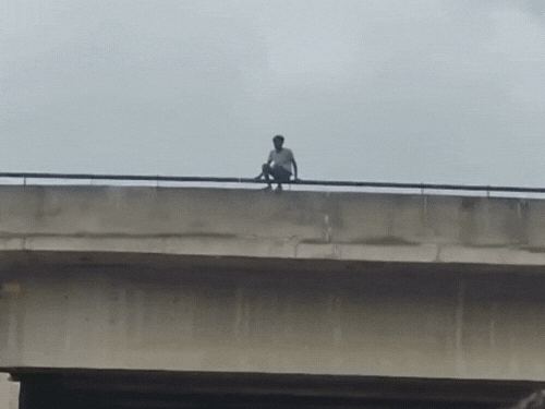 After a dispute with his wife, the young man climbed onto the bridge ...