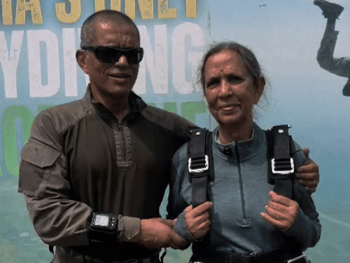 Dr. Sudha Chauhan caressing son after completing the dream of sky diving on the birthday.