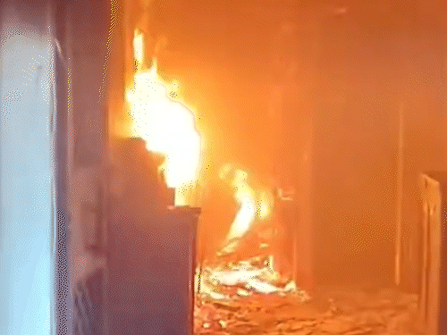 The fire burned more than half of the goods kept inside a flat.