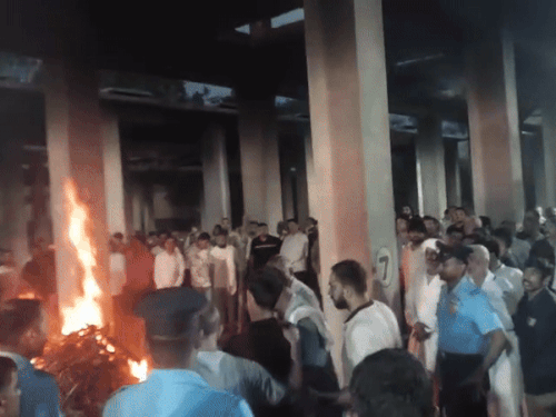 His brother Gyanendra, giving fire to the pyre of martyr Lokendra Singh Sindhu.