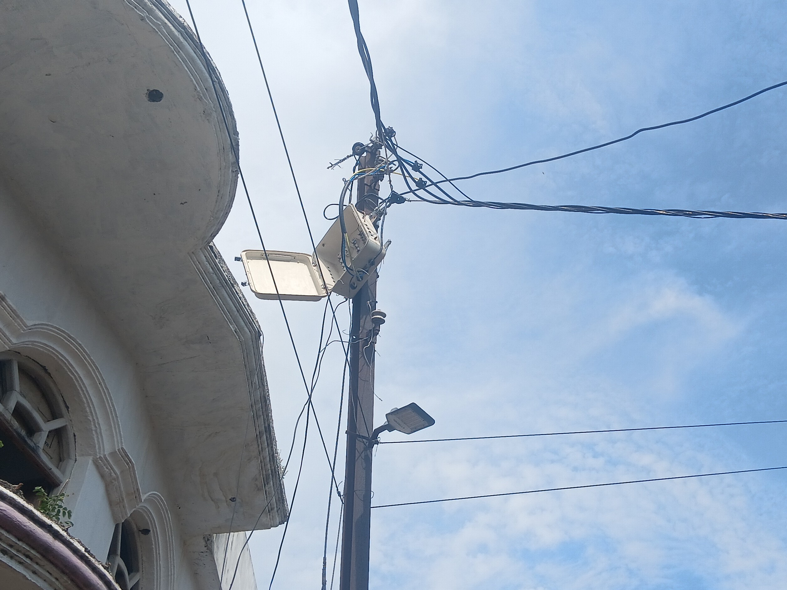 Dilapidated electric poles and tangled wires in Masauli