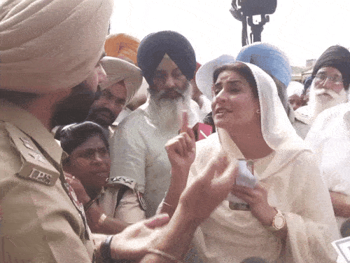 Majithia's wife talking to police officers.