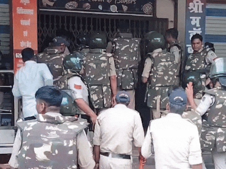 Some protesters were hidden in a shop. The police broke the shutter and took them out.