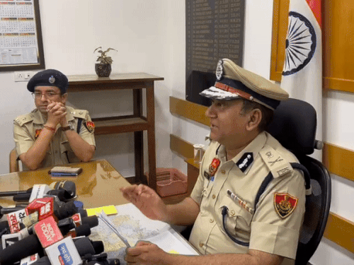 ADGP KK Rao talking to reporters in his office.