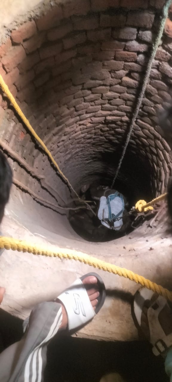 Fire brigade soldiers rescuing a cow falling in a dry well in Sector 92 of Gurugram