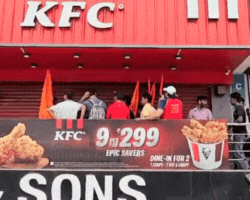 The activists stood on the first floor of the restaurant and waved the saffron flags.