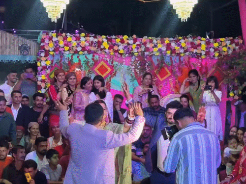 Both brothers dancing with their bride in Shillai.