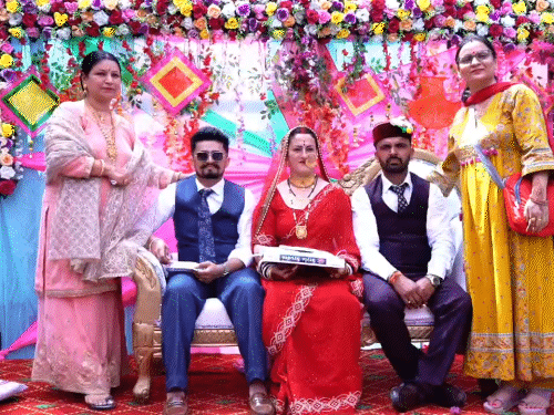 Relatives blessing two brothers and his bride in Shillai.