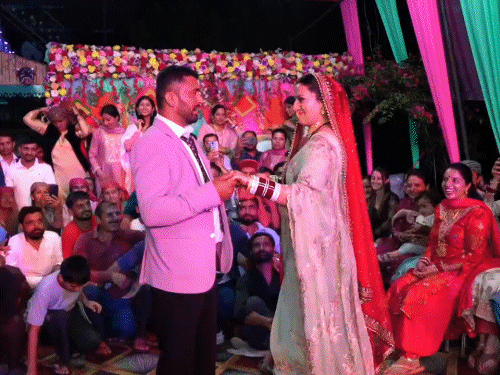 Bride Sunita dancing with elder brother Pradeep in Shilai, Sirmaur.