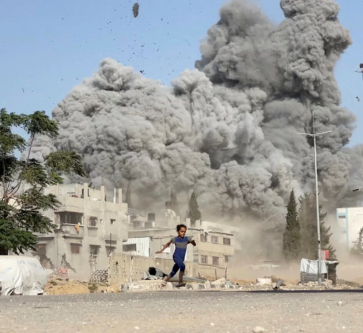 Israel on Wednesday attacked a building in Syrian capital Damascus. A child is trying to save his life amid smoke and debris rising from the explosion.