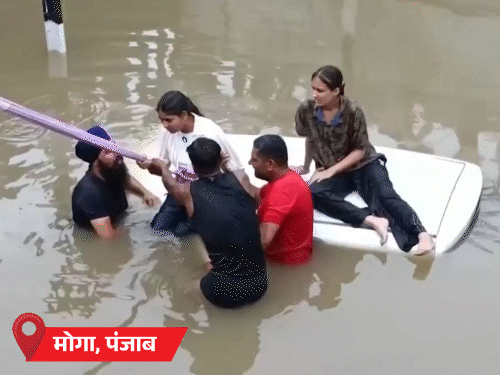 A bridge in Moga was completely submerged, causing a car to flow into the flood waters. Major Baljit Singh jumped into the water to save the trapped family inside.
