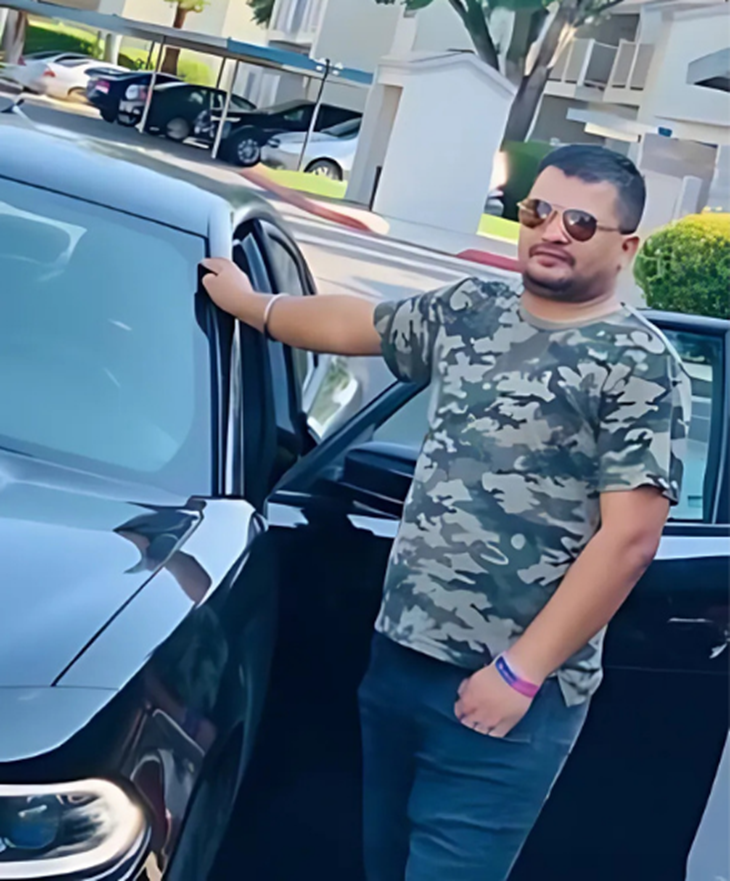 Sanjeev's file photo standing with a car in America.