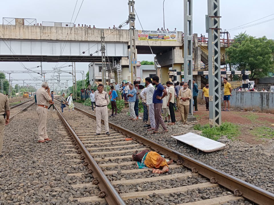A woman died after being hit by a freight train while crossing the ...