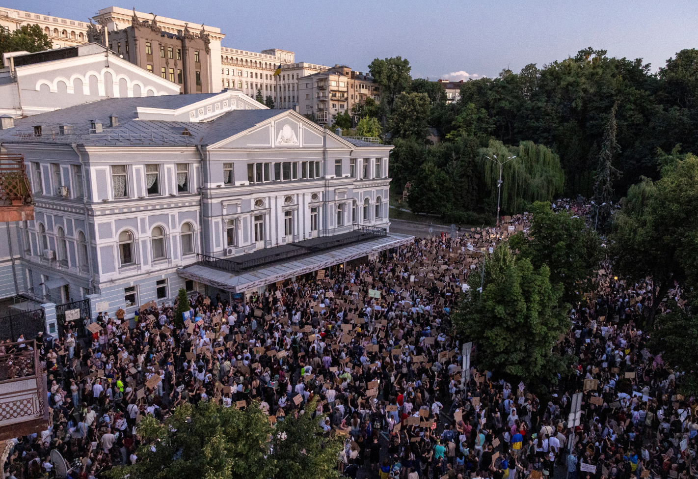 People protesting against the newly passed law near the President's Office in Ukraine.