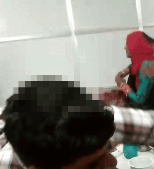 Man opens a bottle of liquor in the party.