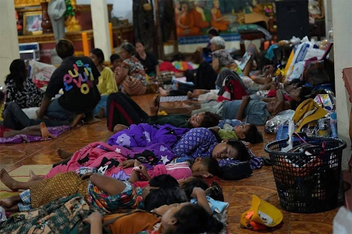 Cambodians, who were displaced due to the fight in Preh Vihier province, are resting in a refugee camp.
