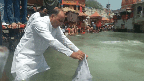 Rajesh Narwal, who version his son Lieutenant Vinay's ashes in the Ganges.