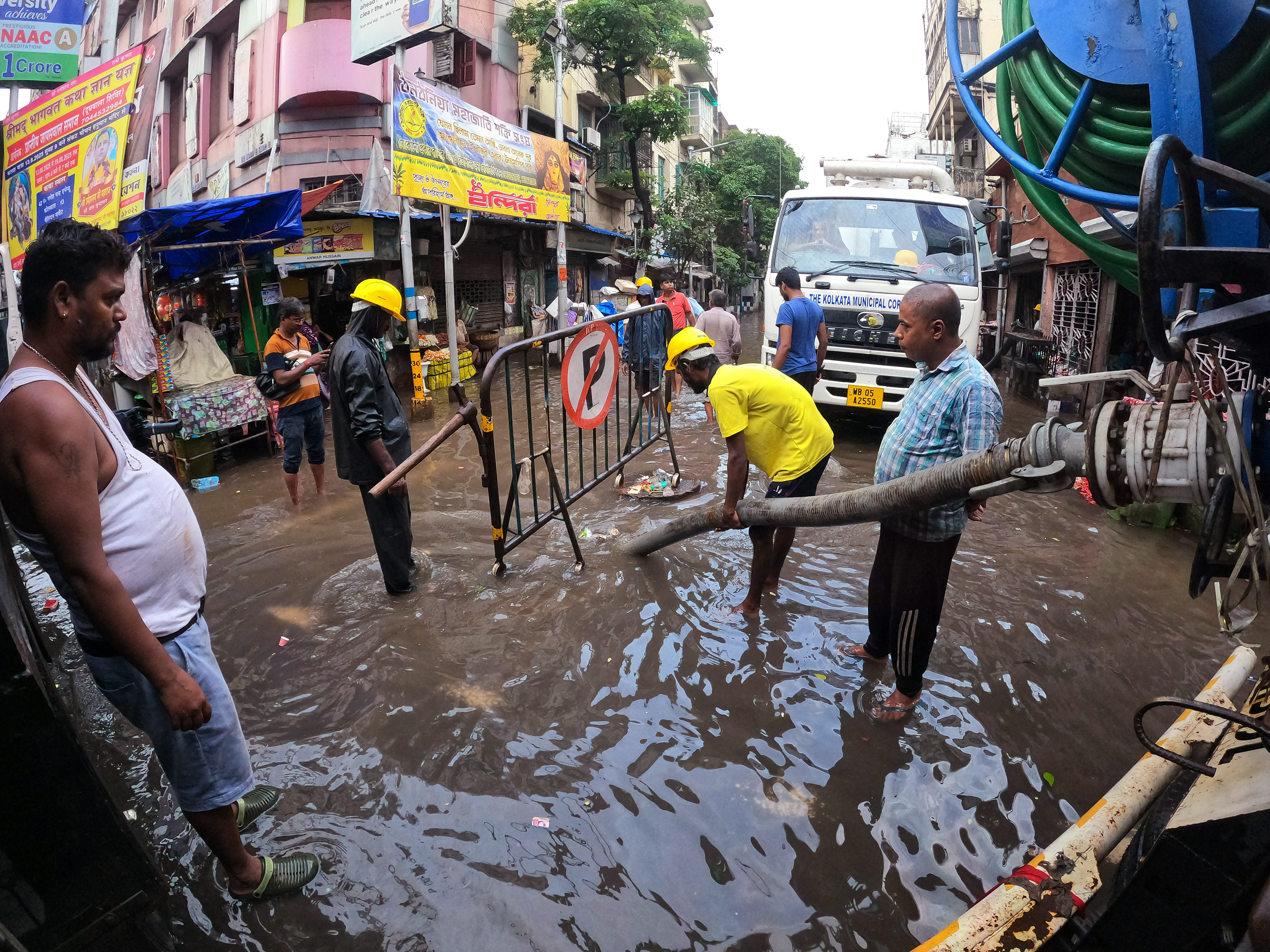 After heavy rains in Kolkata, the municipal employees used the pump filled on the roads.