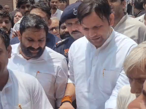 Sports Minister Gaurav Gautam laying the foundation stone of the street.