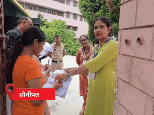 Female teachers entered the exam center in Sonepat.